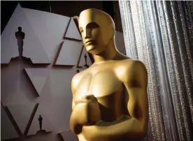  ?? Photograph: Mark Ralston/AFP via Getty Images ?? Virtual gold … an Oscars statuette – will the Academy have enough films to celebrate in 2021?