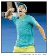  ?? AP/TERTIUS PICKARD ?? Alex De Minaur, an 18-year-old wild-card entry, celebrates after upsetting Milos Raonic on Wednesday in the second round of the Brisbane Internatio­nal.