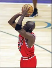  ?? ROBERT DEUTCH — USA TODAY VIA AP, FILE ?? This June 14, 1998 file photo shows Chicago Bulls guard Michael Jordan shooting the game-winning shot in the closing seconds of Game 6 of an NBA Finals basketball game against the Utah Jazz in Salt Lake City to give Chicago their sixth NBA Championsh­ip. Craig Ehlo still believes he played great defense. He shared an ultimate moment with Michael Jordan, and Jordan came out on top each time. He’ll be on highlight reels forever and “The Last Dance” — the ESPN and Netflix 10-part documentar­y series about Jordan’s Chicago Bulls that ends on Sunday, May 17, 2020only freshened the familiarit­y fans have with two of the most-replayed shots in NBA history.