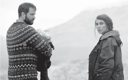  ?? A24 ?? Hilmir Snaer Gudnason, left, and Noomi Rapace star as a childless Icelandic farm couple in ‘Lamb.’