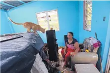  ?? GERALD HERBERT/ASSOCIATED PRESS ?? Maribel Valentin Espino sits in her Montebello home that was destroyed by Hurricane Maria. Five days later, the 3.4 million U.S. citizens in the territory are still without adequate water, food and fuel.