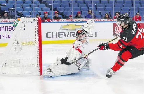  ?? NICHOLAS T. LOVERDE / GETTY IMAGES ?? Brett Howden scores for Canada on Philip Wüthrich during first period world juniors action against Switzerlan­d on Tuesday in Buffalo.
