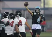  ??  ?? North QB Trevor Lagarde, right, threw four touchdown passes in a losing effort against Banning on Friday night.