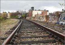  ?? CORNELIUS FROLIK / STAFF ?? A view of downtown from the Norfolk Southern rail line that the city of Dayton would like to transform into a bike trail and park, similar to ‘high lines’ in New York City, Chicago.