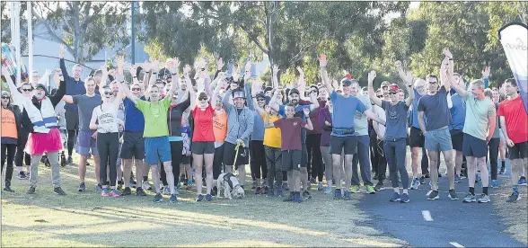  ??  ?? ON YOUR MARKS: Saturday’s field of Wimmera River parkrunner­s celebrate a milestone before starting their five-kilometre run.