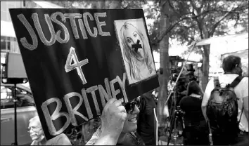  ?? CHRIS PIZZELLO / ASSOCIATED PRESS ?? A supporter of Britney Spears holds a sign outside a hearing concerning the pop singer’s conservato­rship July 14 in Los Angeles.
