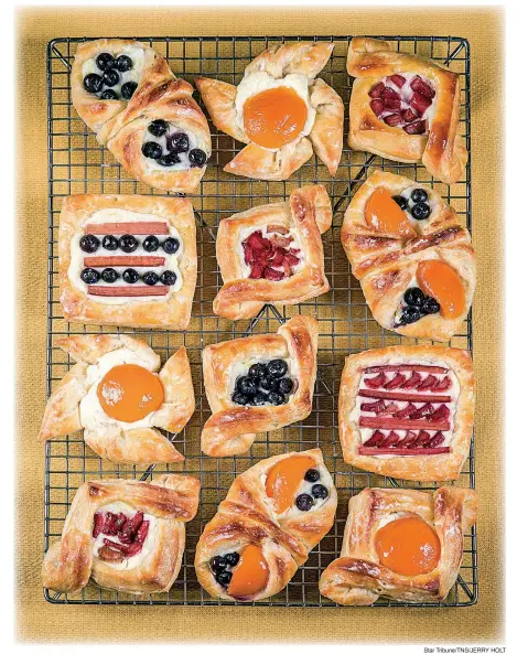  ?? Star Tribune/ TNS/ JERRY HOLT ?? Danish pastries with lemon cream cheese fi lling can be shaped as desired and fi lled with canned or fresh fruit such as apricots, blueberrie­s and rhubarb.