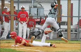  ?? GENE WALSH — DIGITAL FIRST MEDIA ?? Souderton’s Blaise Sclafani dives into home a hame run as Perkasie’s catcher, Kevin Knapp reaches for the ball June 27, 2018.