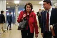  ?? AP/J. SCOTT APPLEWHITE ?? Sen. Dianne Feinstein, D-Calif., the ranking member of the Senate Judiciary Committee, heads to the Senate chamber Wednesday to vote on federal judges, a day before the Senate faces a key vote on a budget deal.