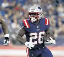  ?? WINSLOW TOWNSON/AP ?? Patriots’ Sony Michel runs the ball against the Washington Football Team in 2021 at Gillette Stadium in Foxborough, Mass.