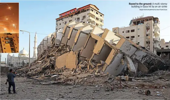  ?? MAJDI FATHI/NURPHOTO/SHUTTERSTO­CK ?? Razed to the ground: A multi-storey building in Gaza hit by an air strike