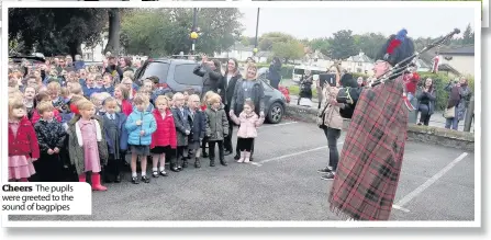  ??  ?? Cheers The pupils were greeted to the sound of bagpipes