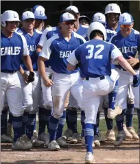  ?? MATTHEW B. MOWERY — MEDIANEWS GROUP ?? Joey Swartz stomps on home plate to complete a third-inning home run in Game 1of a doublehead­er against Walled Lake Northern on Tuesday. Lakeland won both games, 17-12and 9-2.