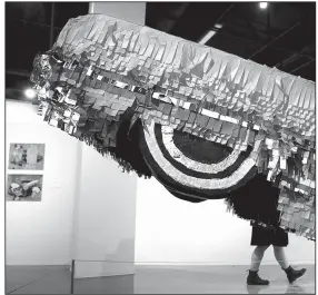  ?? AP/JAE C. HONG ?? Lowrider-inspired artwork like Gypsy Rose Pinata by Justin Favela is on display in “The High Art of Riding Low” at Los Angeles’ Petersen Automotive Museum.