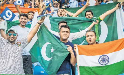  ?? Photos by Neeraj Murali ?? Cricket fans from India and Pakistan turned up in large numbers at the Dubai Internatio­nal Stadium to support their respective teams during the crucial Super Four clash in the Asia Cup cricket tournament on Sunday. —