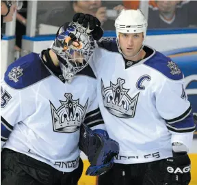  ?? CP FILE PHOTO ?? Jason LaBarbera receives congratula­tions from team captain Rob Blake while both were members of the Los Angeles Kings on Jan. 15, 2008. LaBarbera had just made 32 saves in a 3-1 road win against the Edmonton Oilers.