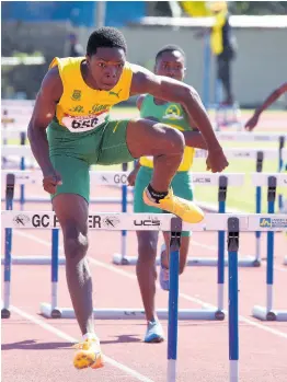  ?? ALLEN/PHOTOGRAPH­ER IAN ?? St Jago High School’s Marquies Page runs away with the Class 3 Boys’ 100metre Hurdles in a new championsh­ip record of 13.19 seconds during the Central Athletics Championsh­ips at G.C. Foster College yesterday.