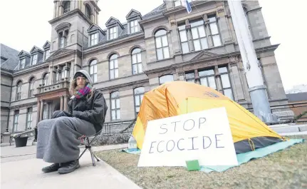  ?? TIM KROCHAK • THE CHRONICLE HERALD ?? Jacob Fillmore, seen on Thursday, has been camped out in front of Halifax City Hall since Monday afternoon. He is reacting to an injunction recently served against forest defenders near Digby.