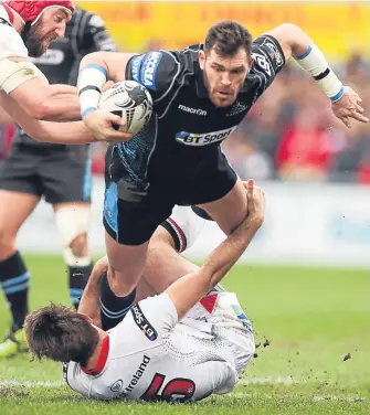  ??  ?? Glasgow’s Sean Lamont is tackled by Ulster’s Louis Ludik at the Kingspan Stadium yesterday.