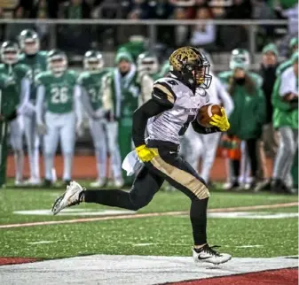  ?? Michael M. Santiago/Post-Gazette ?? Belle Vernon wide receiver Nolan Labuda runs for a 69-yard touchdown against South Fayette. He caught eight passes for 119 yards.