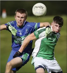  ??  ?? AGB’s Jonathan Devereux and Avondale’s Tyrone Byrne battle for posession during the MFC semi-final.