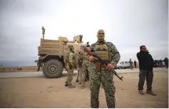  ?? (Rodi Said/Reuters) ?? SYRIAN DEMOCRATIC FORCES and US troops patrol near Turkish border in Hasakah, Syria, last week.