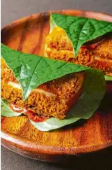  ??  ?? Thevar’s crispy pork, sambal aioli, betel leaf