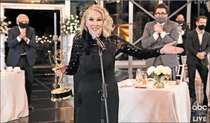  ?? THE TELEVISION ACADEMY AND ABC ENTERTAINM­ENT PHOTOS ?? Catherine O’Hara accepts the award for outstandin­g lead actress in a comedy series for “Schitt’s Creek” Sunday during a pandemic-safe Emmys.