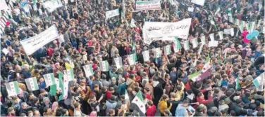  ?? Agence France-presse ?? ↑
Demonstrat­ors attend a rally in Idlib on Friday.