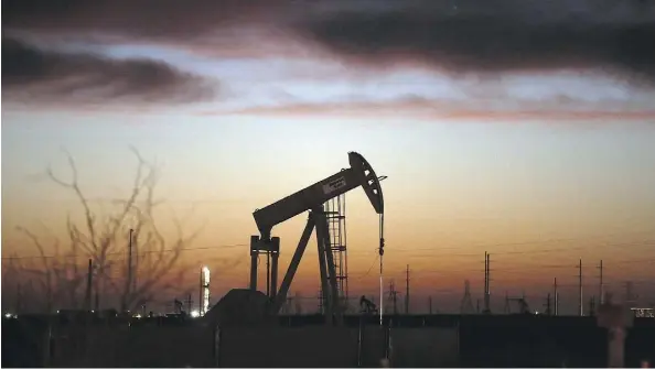  ?? SPENCER PLATT/GETTY IMAGES/FILES ?? An oil pumpjack works in the Permian Basin oilfield in Andrews, Texas. Canadian companies are following in the footsteps of U.S. producers in the region, which are harnessing data to improve their performanc­e.