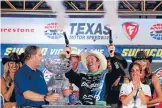  ?? Photo: GETTY IMAGES ?? Scott Dixon celebrates in Victory Lane after winning the IndyCar series Firestone 600 at Texas Motor Speedway.