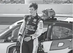  ?? ASSOCIATED PRESS ?? Harrison Burton is all smiles after winning the NASCAR Xfinity Series race Saturday at Homestead-Miami Speedway.