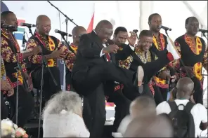  ?? (AP/Themba Hadebe) ?? South African President Cyril Ramaphosa (center) dances to music as he attends Freedom Day celebratio­ns in Pretoria, South Africa, on Saturday. More photos at arkansason­line.com/428freedom­30/.