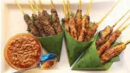  ??  ?? All skewed up: Satay (pork, chicken, beef on skewers served with peanut sauce)