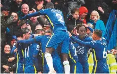  ?? AFP ?? Chelsea’s striker Timo Werner celebrates with teammates after he scores his team’s second goal yesterday.