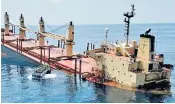  ?? ?? British-registered cargo vessel Rubymar sinking after being damaged in a missile attack by the Houthis in the Red Sea off the coast of Yemen