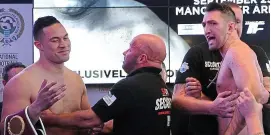  ??  ?? Belt up: security guards step in as Hughie Fury (right) hurls insults at champion Joseph Parker during the weigh-in