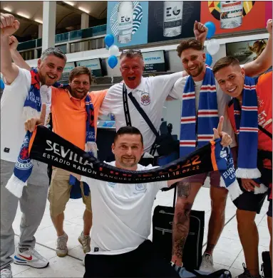  ?? Picture: Colin Mearns ?? Rangers fans at Glasgow Airport before catching a flight to Spain for the Europa League final in Seville