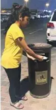  ??  ?? Neola Castelino has made it her mission to help municipali­ty workers in Al Nahda 2, by disposing of massage parlour cards.