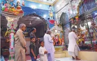  ?? AFP ?? Hindus at the Shri Krishna Temple in Mithi — a mostly Hindu city of 60,000 people.