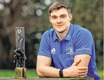  ?? RAMSEY CARDY/ SPORTSFILE ?? Garry Ringrose and Beibhinn Parsons (inset) with their Guinness Rugby Writers of Ireland Player of the Year awards for 2020