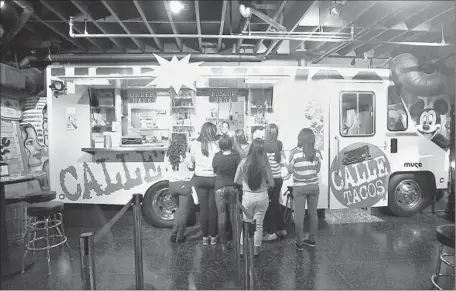  ?? Photog raphs by Gary Friedman Los Angeles Times ?? MIKE ISRAYELYAN and two associates spent $20,000 to have a stainless steel copy of the side of a food truck made for their restaurant.