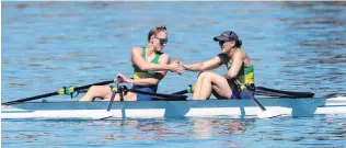 ?? PHOTO: SHARRON BENNETT ?? Dunstan Arms’ Sophie Smith and Kirsty Mahoney celebrate silver in the women’s double club sculls at the National Rowing Championsh­ips at Lake Ruataniwha, Twizel, yesterday.
