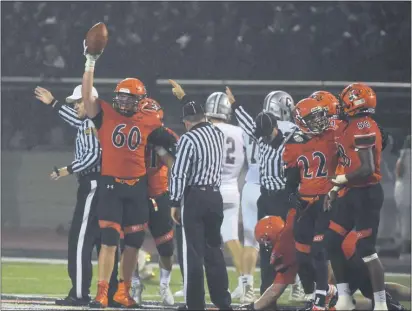  ?? PETE BANNAN — MEDIANEWS GROUP ?? Marple Newtown’s Johnnie Ebert, left, holds up his recovered fumble for display in a game against Conestoga last season.