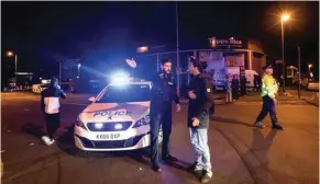  ?? — Reuters ?? CARNAGE: Police set up a cordon outside the Manchester Arena in northern England where U.S. singer Ariana Grande had been performing in Manchester, Britain, on Tuesday.