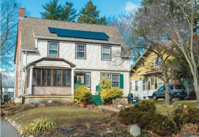  ?? AARON FLAUM/HARTFORD COURANT ?? Solar panels are attached to Sophia Taylor-edwards’ home in Hartford. The Solar for All program, which Taylor-edwards used to get the panels, is again open to Hartford residents.