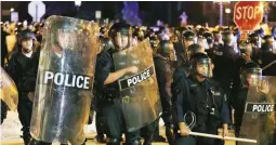  ??  ?? ANGRY MOB – Police are on guard as protesters gather, September 15, in St. Louis, Missouri, after a judge found a white former St. Louis police officer, Jason Stockley, not guilty of first-degree murder in the death of a black man, Anthony Lamar Smith,...