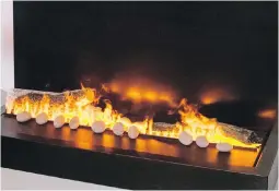  ?? DEBBIETRAV­IS.COM ?? Enjoy the light show from the Optimyst’s innovative fireplace design.