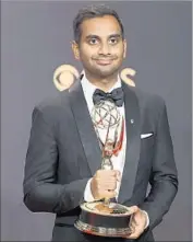  ?? Allen J. Schaben Los Angeles Times ?? AZIZ ANSARI shows off his Emmy for writing on a comedy series for his Netf lix show “Master of None.”