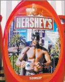  ??  ?? Court documents This image on bottles of Hershey’s chocolate syrup has spurred a lawsuit.